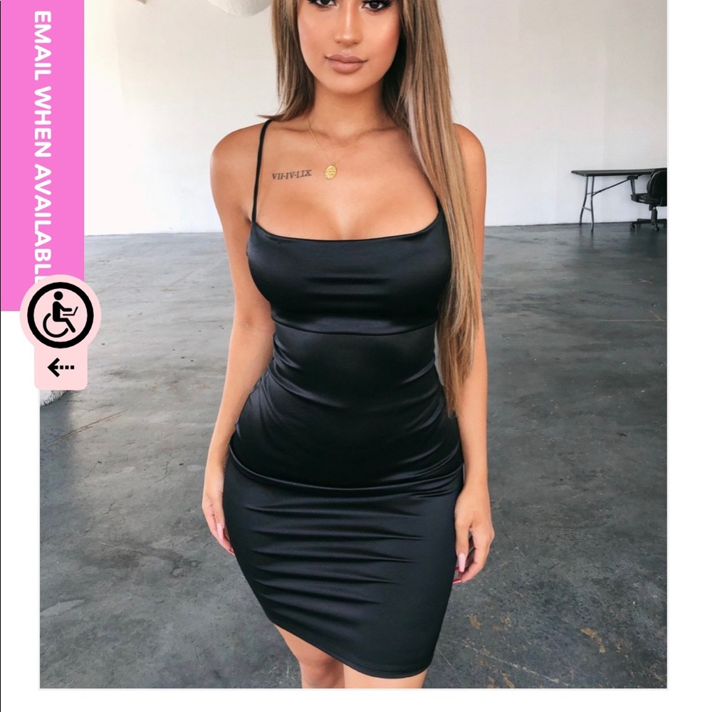 Form fitting black dress with strappy back 😍😍